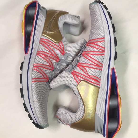 nike shox gravity vast grey metallic gold